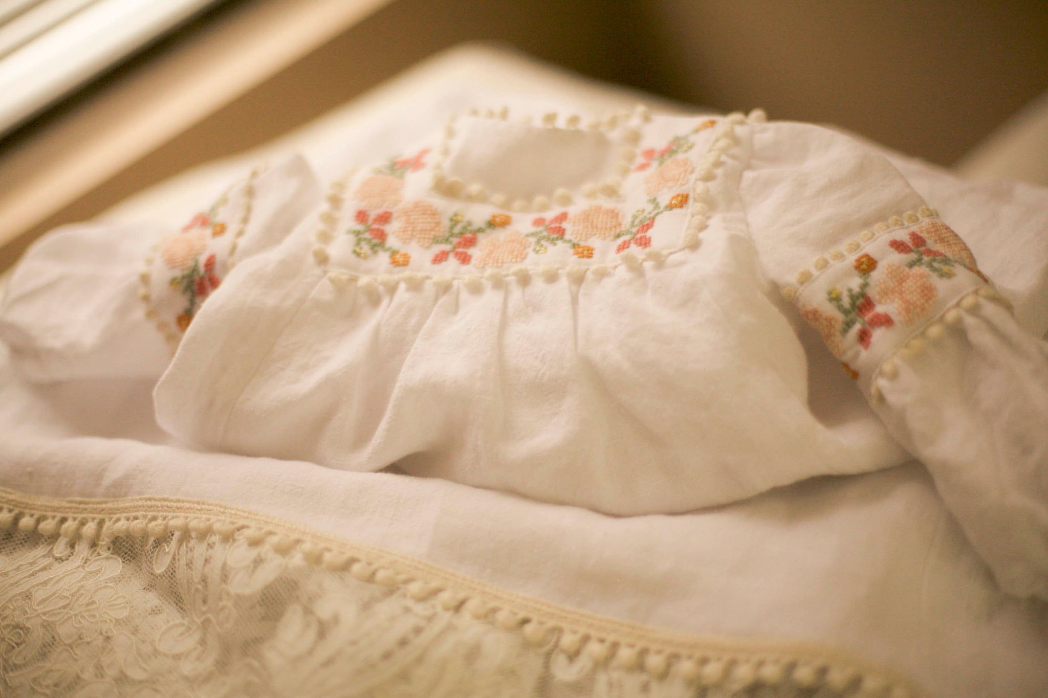 Unveiling Elegance: A Closer Look at the Embroidered Baptismal Gown