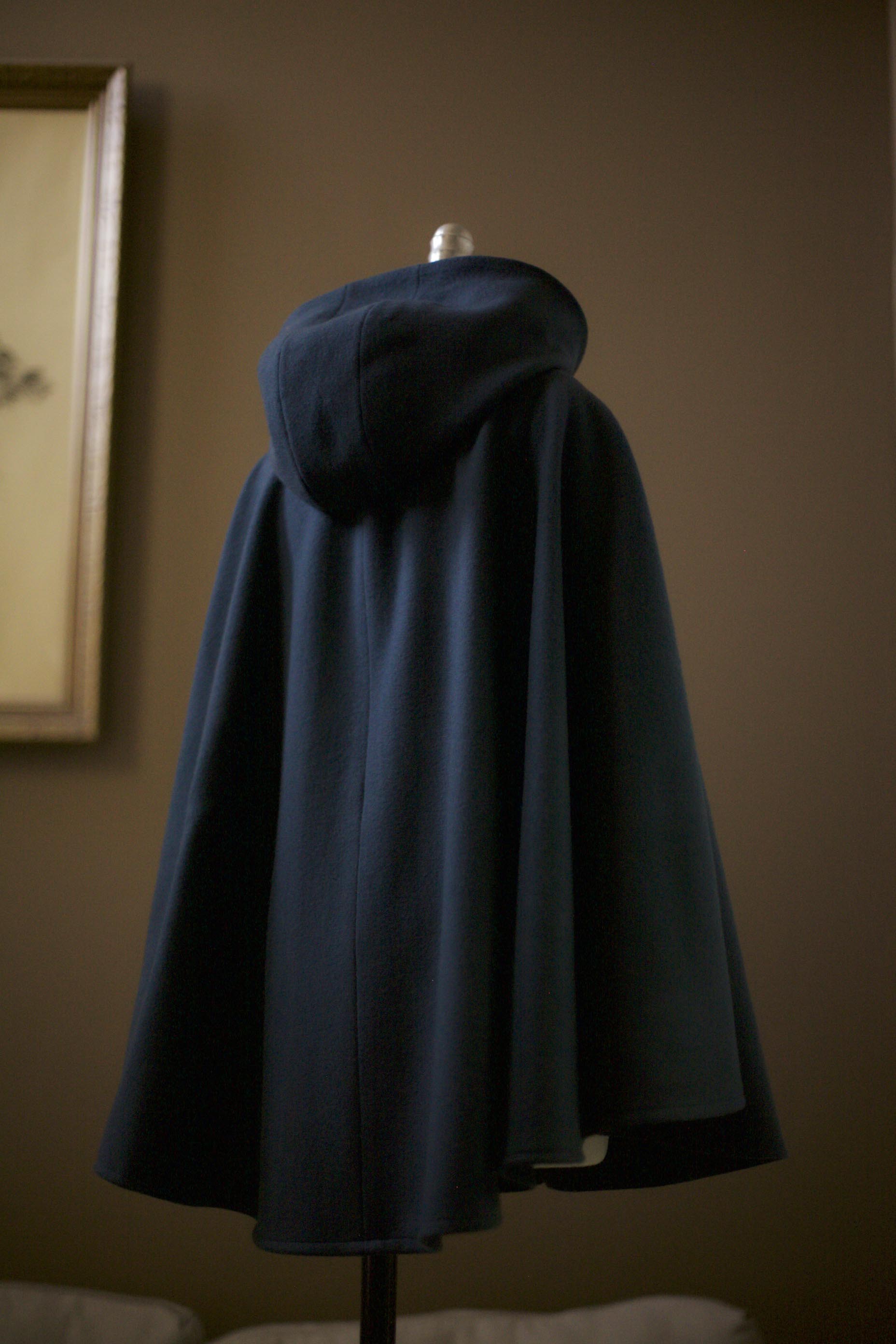 teal cape with hood