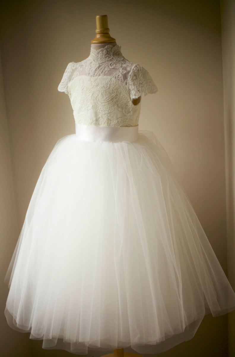 Sleeved Communion Lace Peplum Dress with Corset Back #TK1198 | Norma Reed main image 0