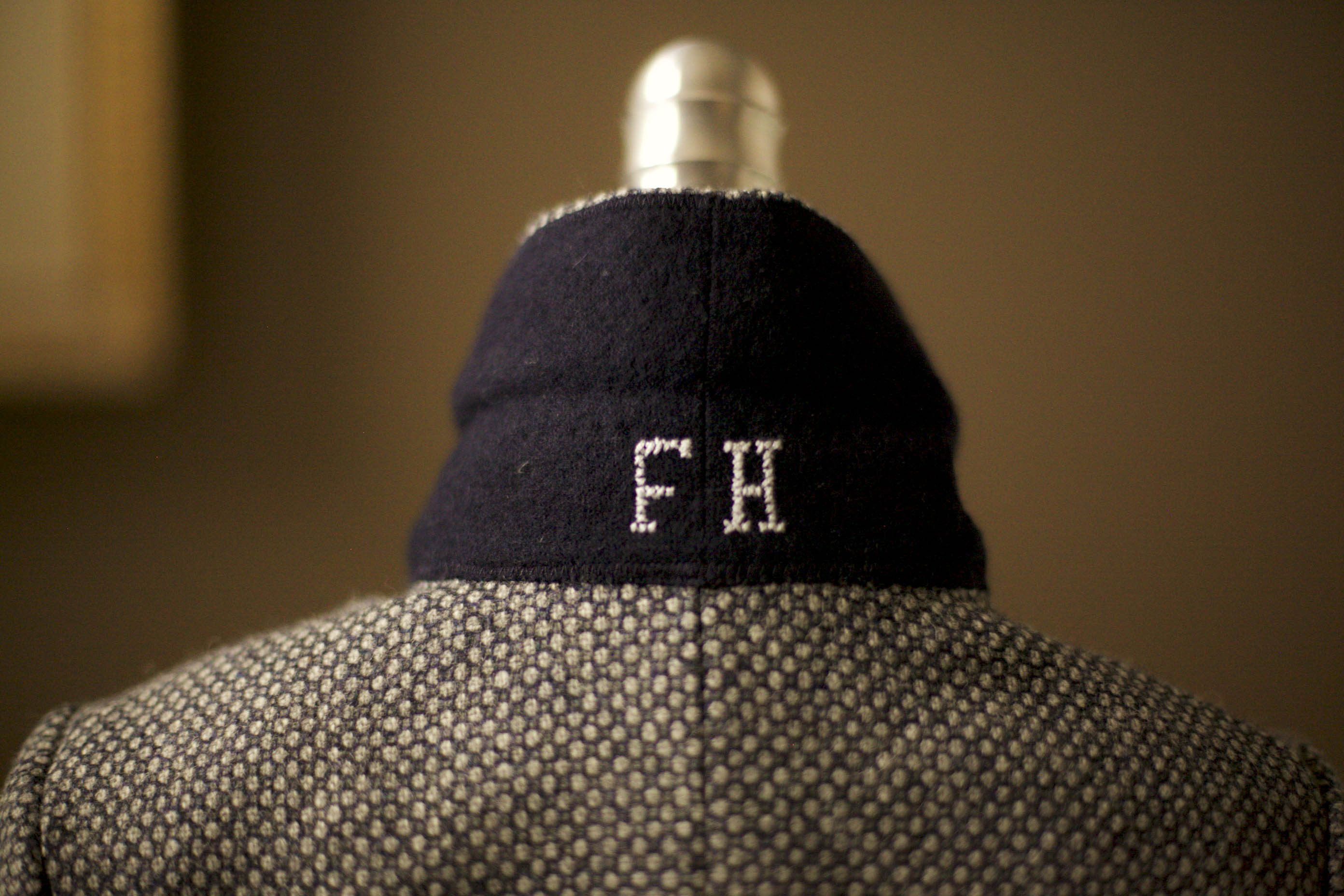initials embroidered under collar of jacket