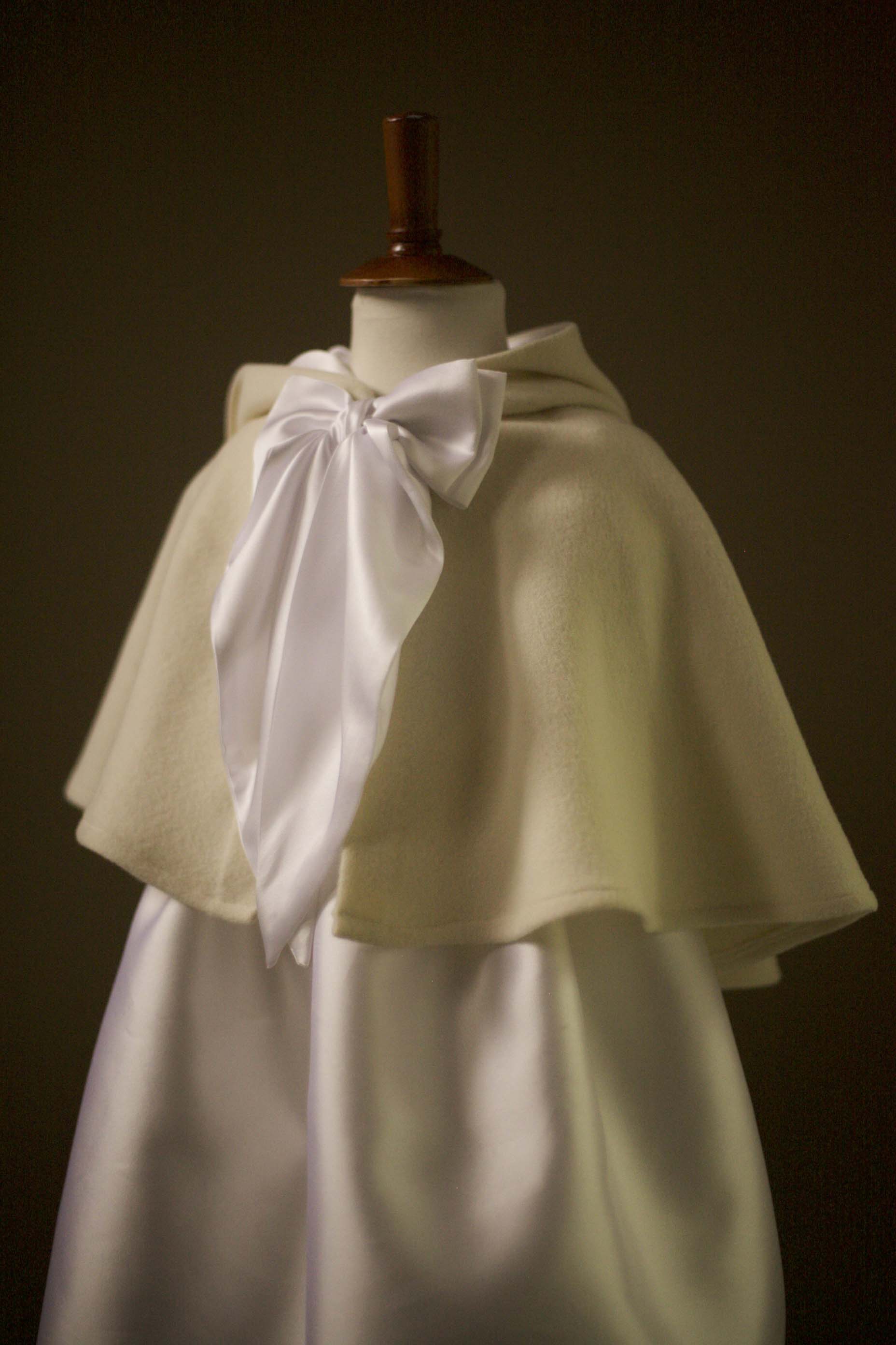 white cape with bow