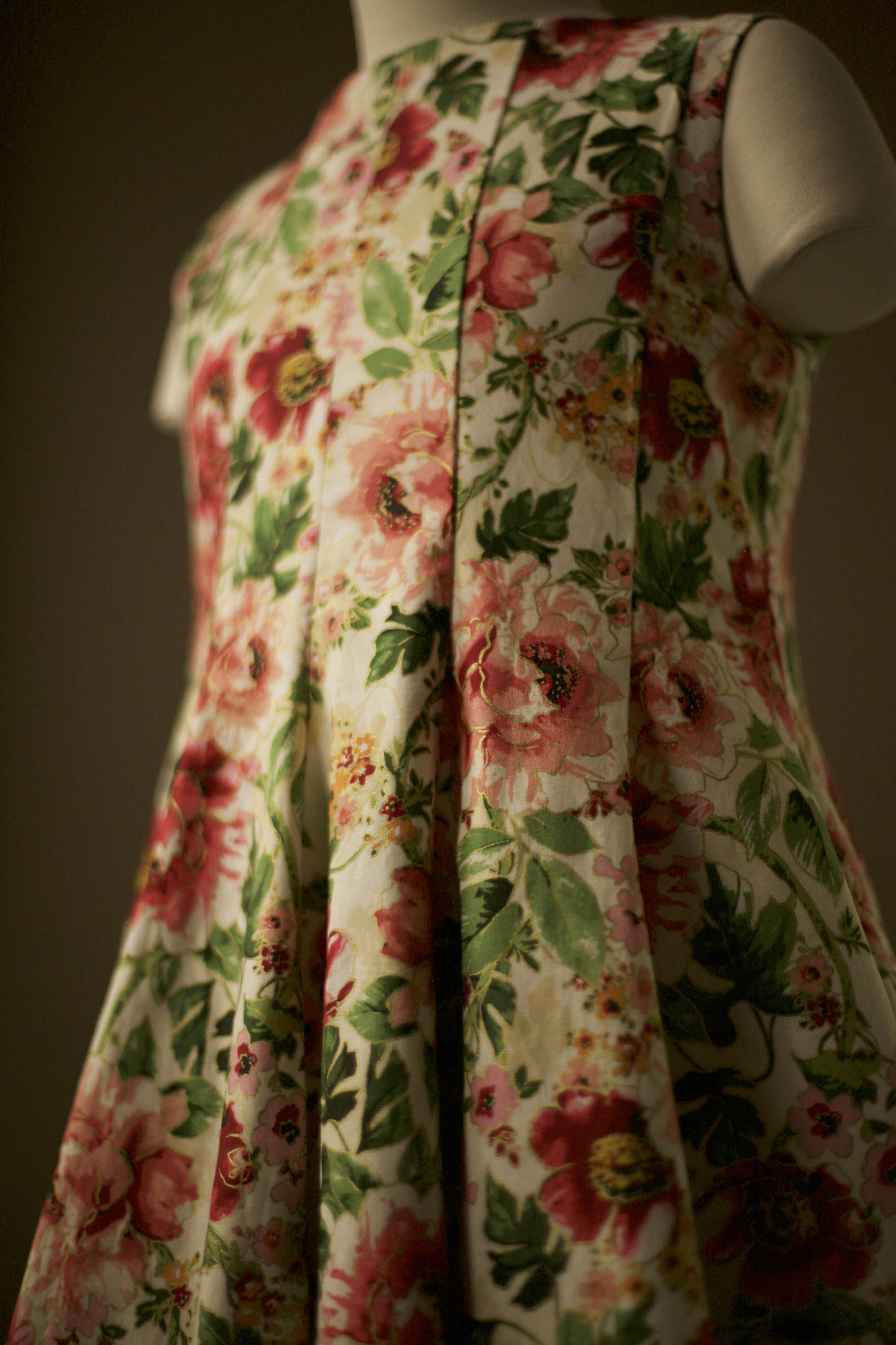 Detail of sleeveless floral dress bodice with boat neckline