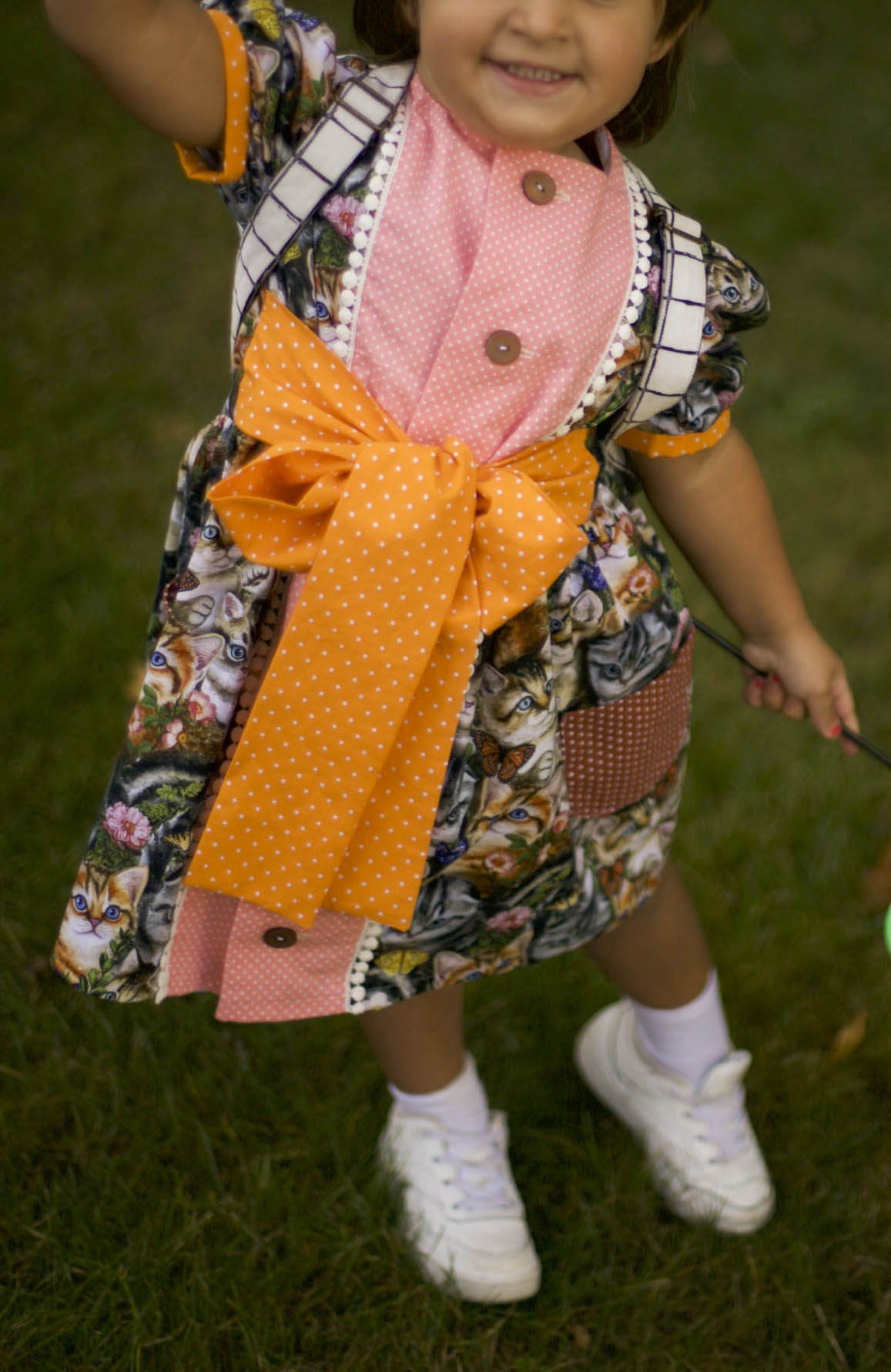 100% cotton kitty cat print fabric with floral accents