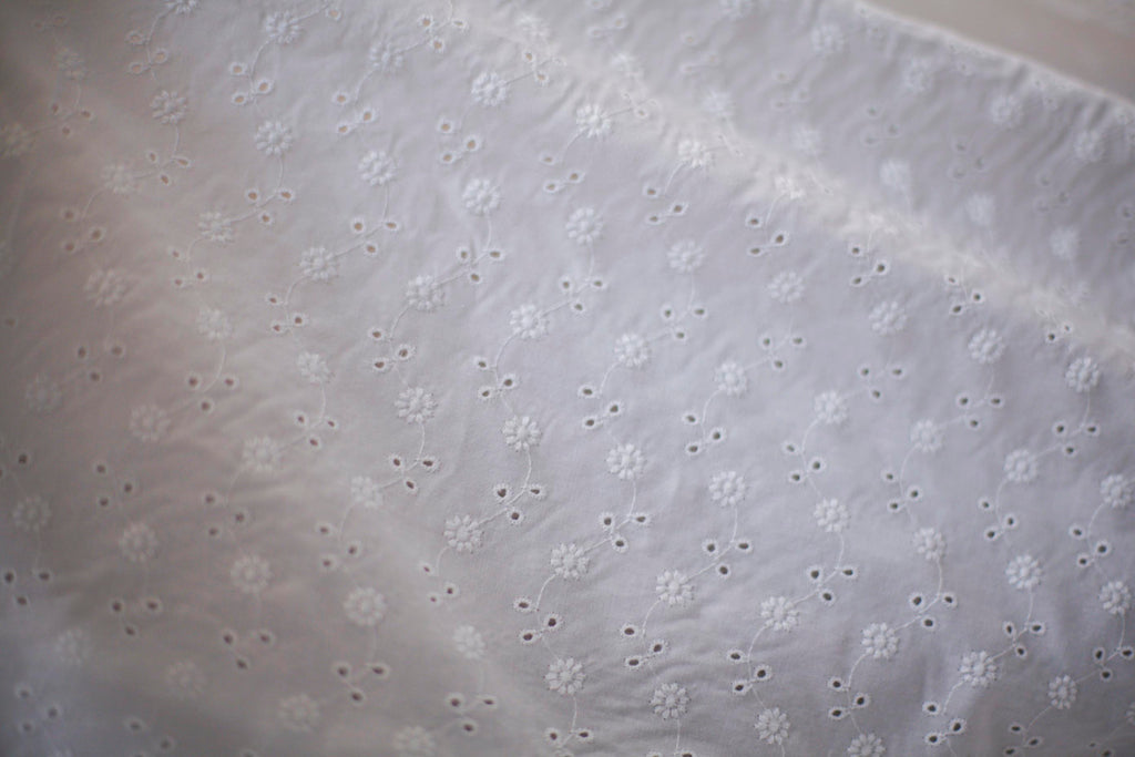white eyelet fabric