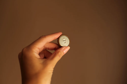gold button with antique leather