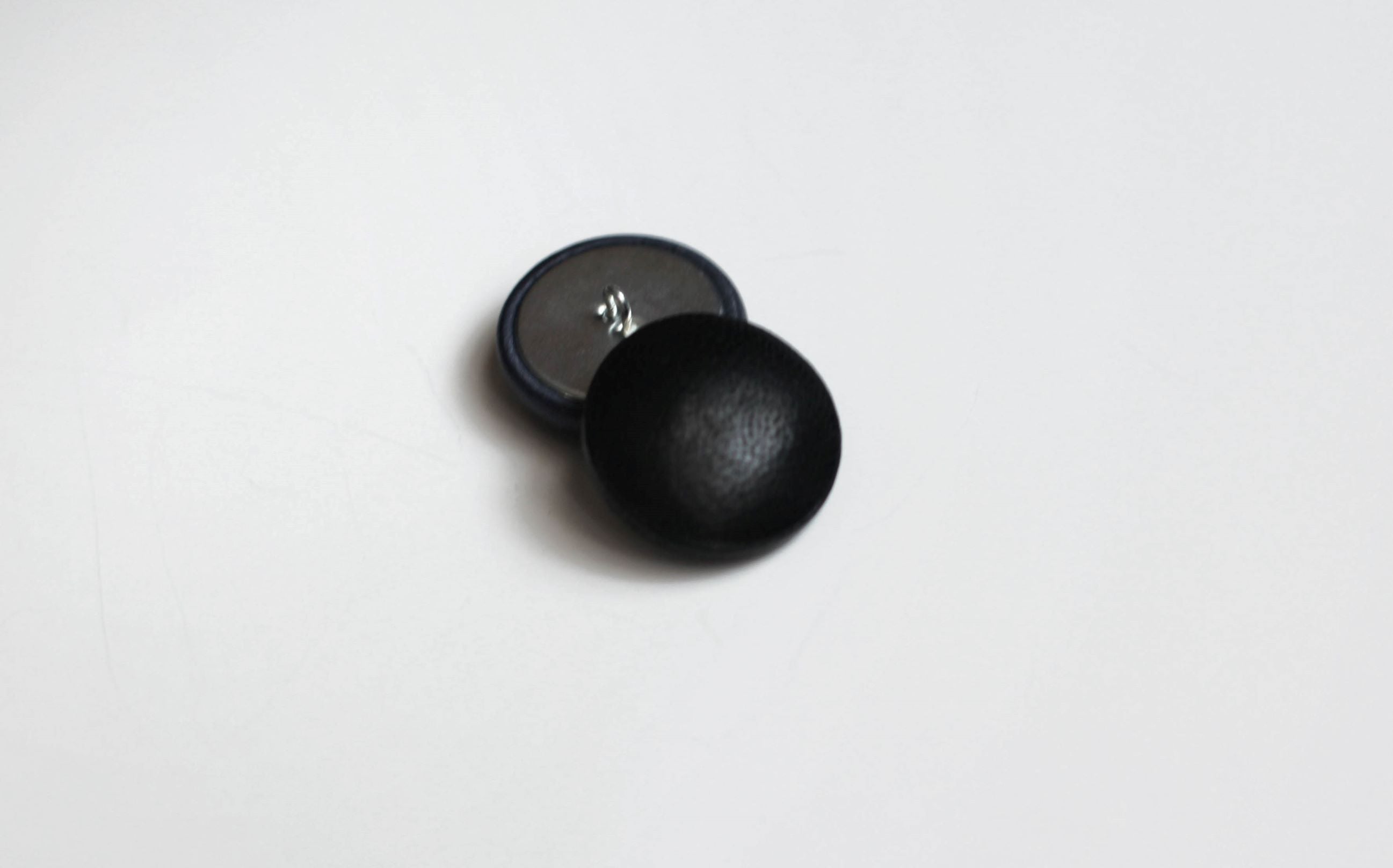 black leather buttons