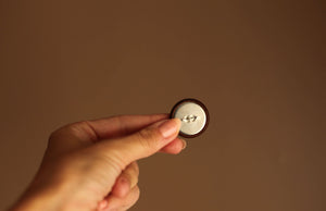 brown leather button