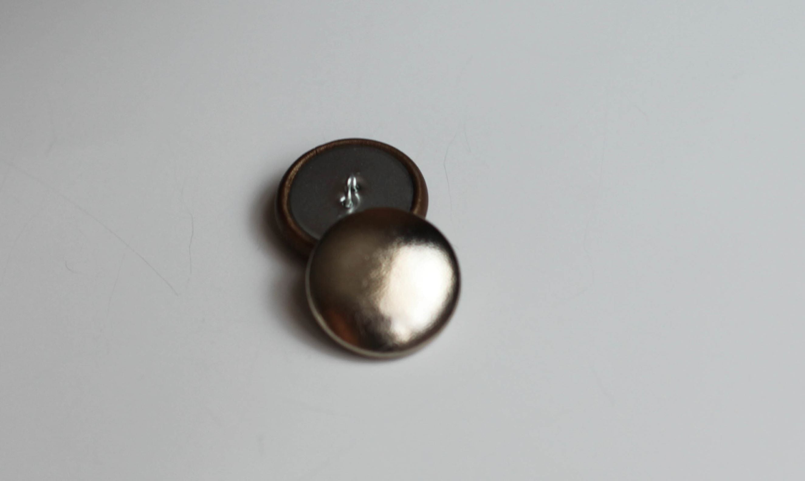 leather buttons gold