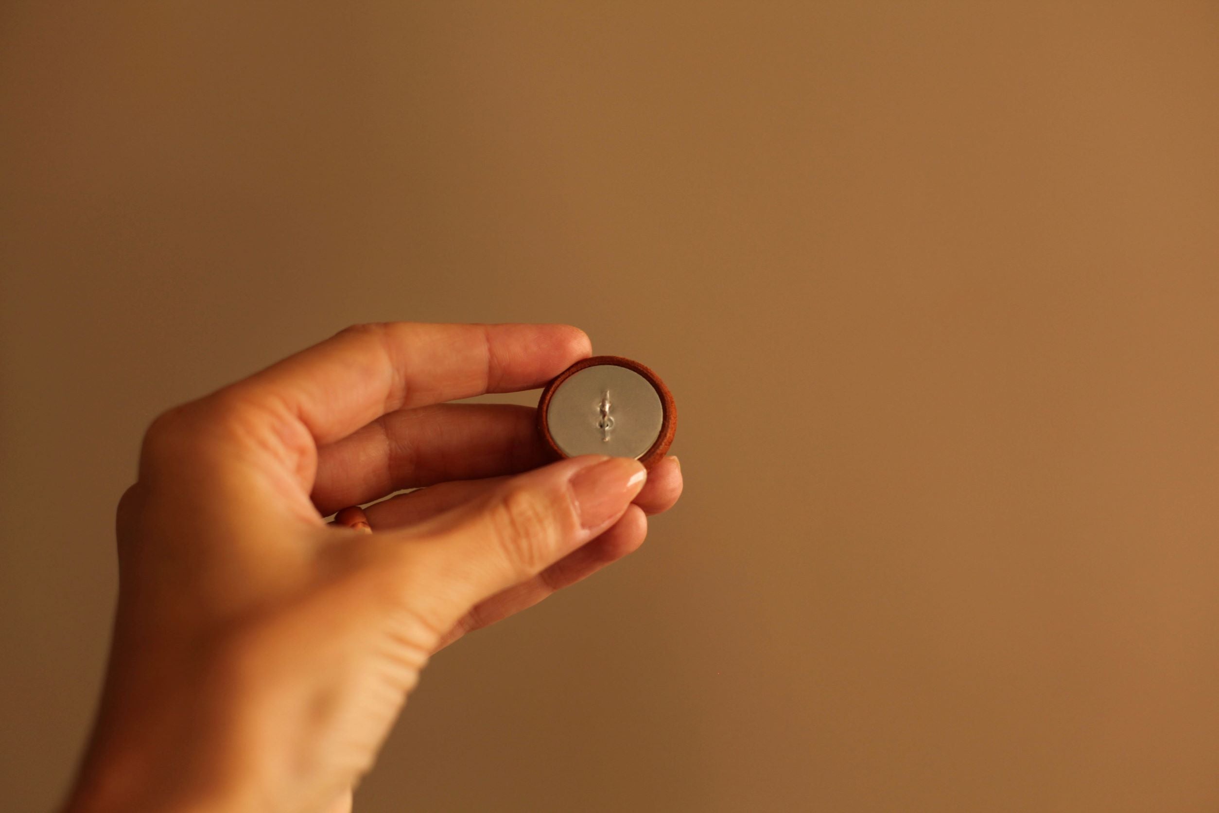 leather button with metal shank