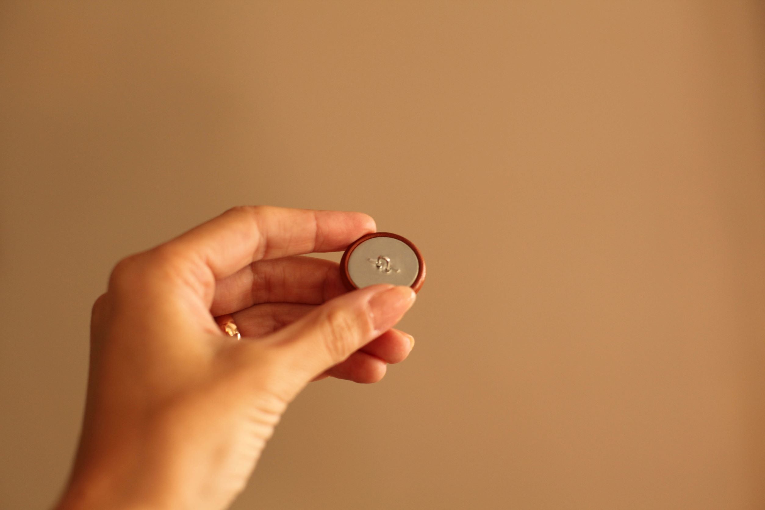 black leather button with metal shank