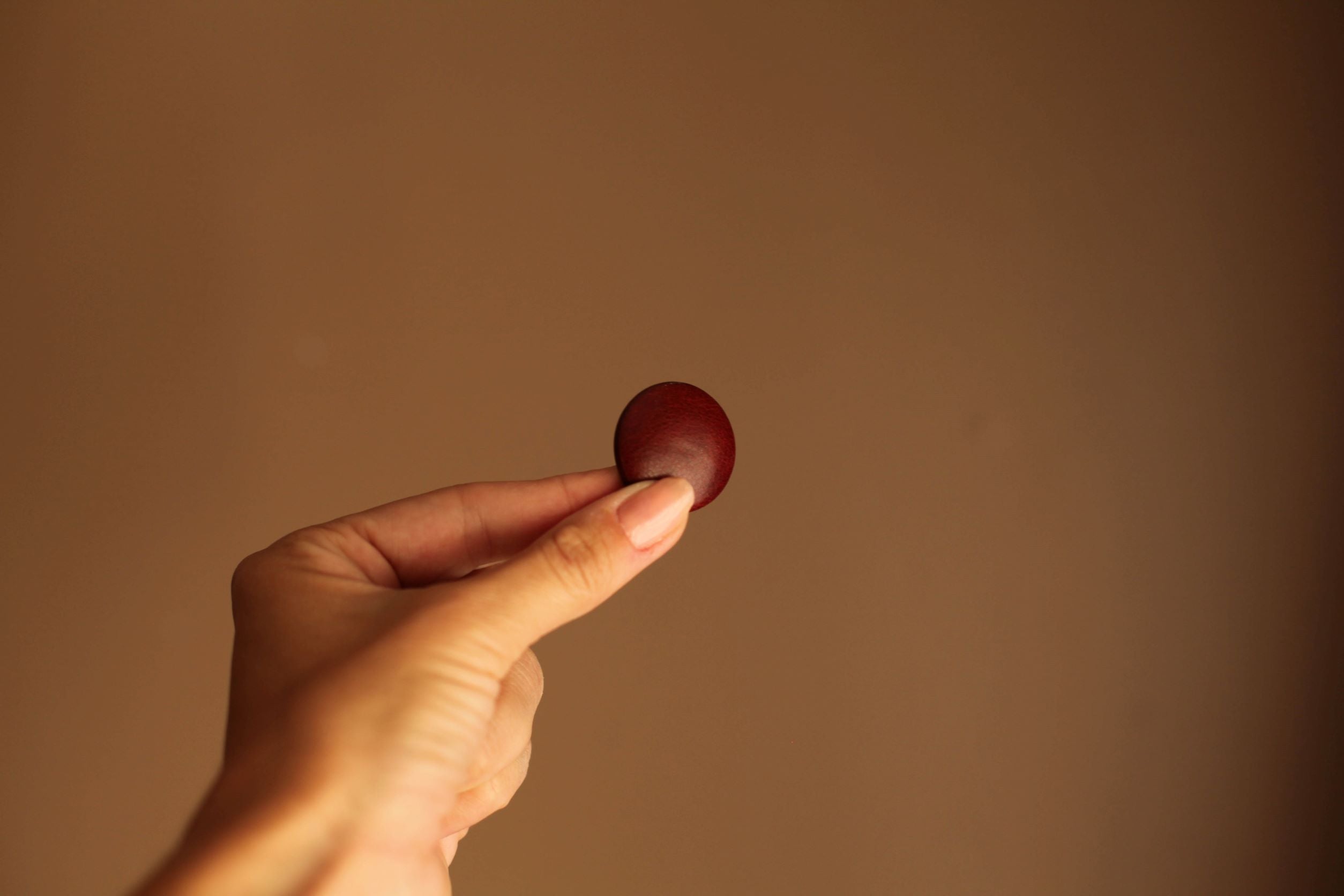 mahogany leather button