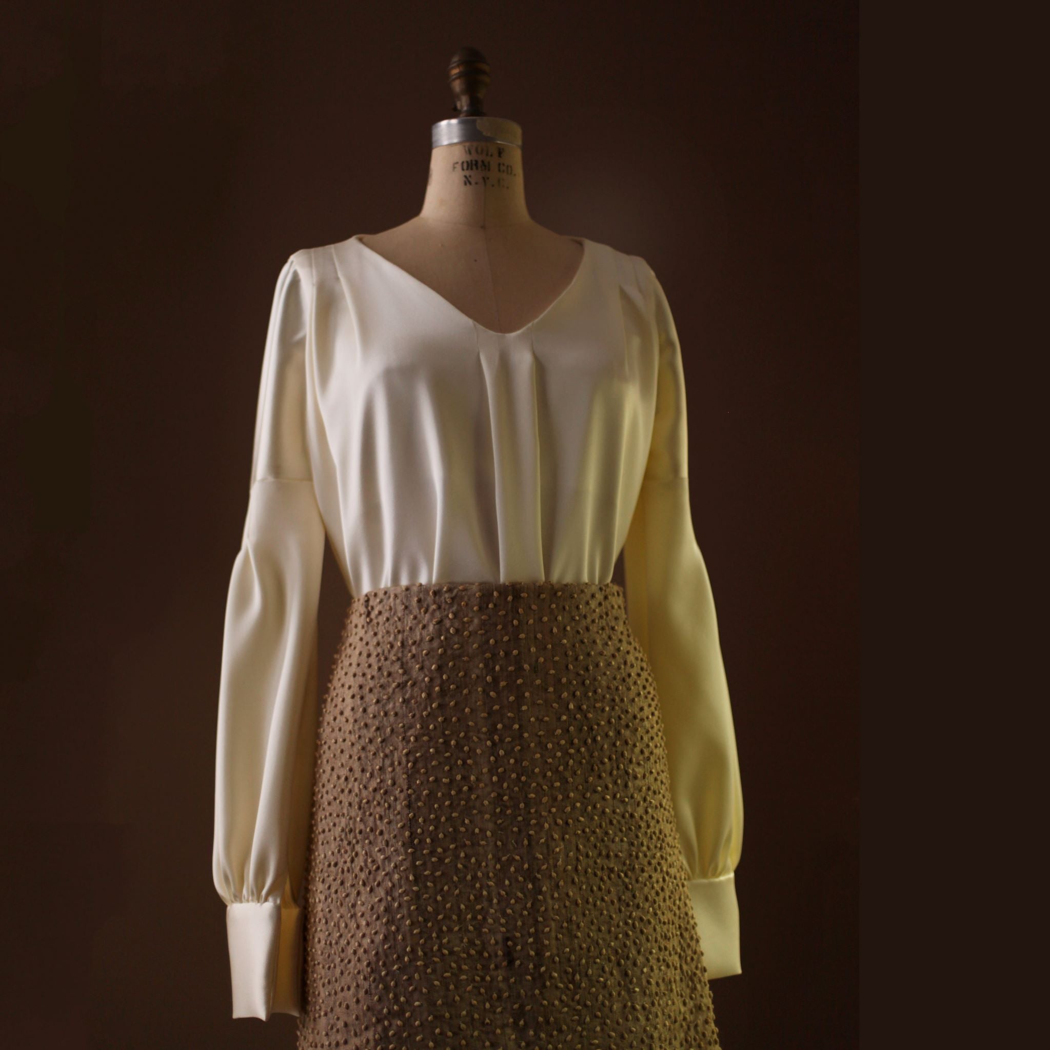 pleated silk blouse