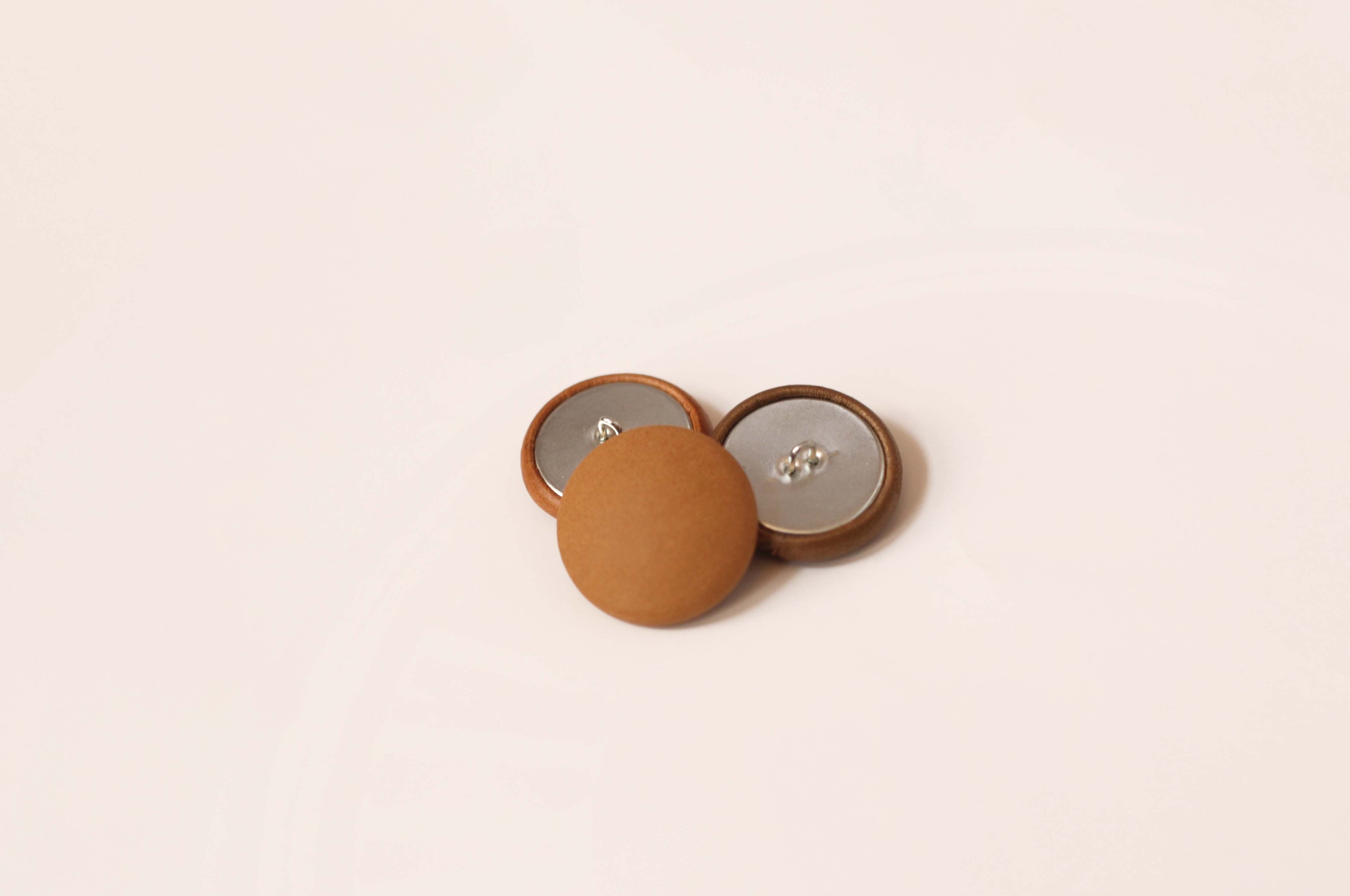 real leather button tan